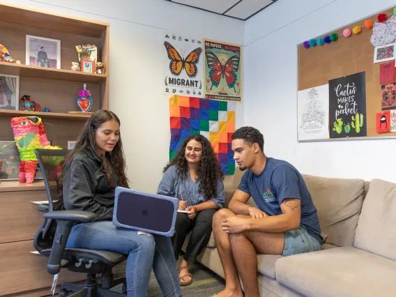 People looking at computer
