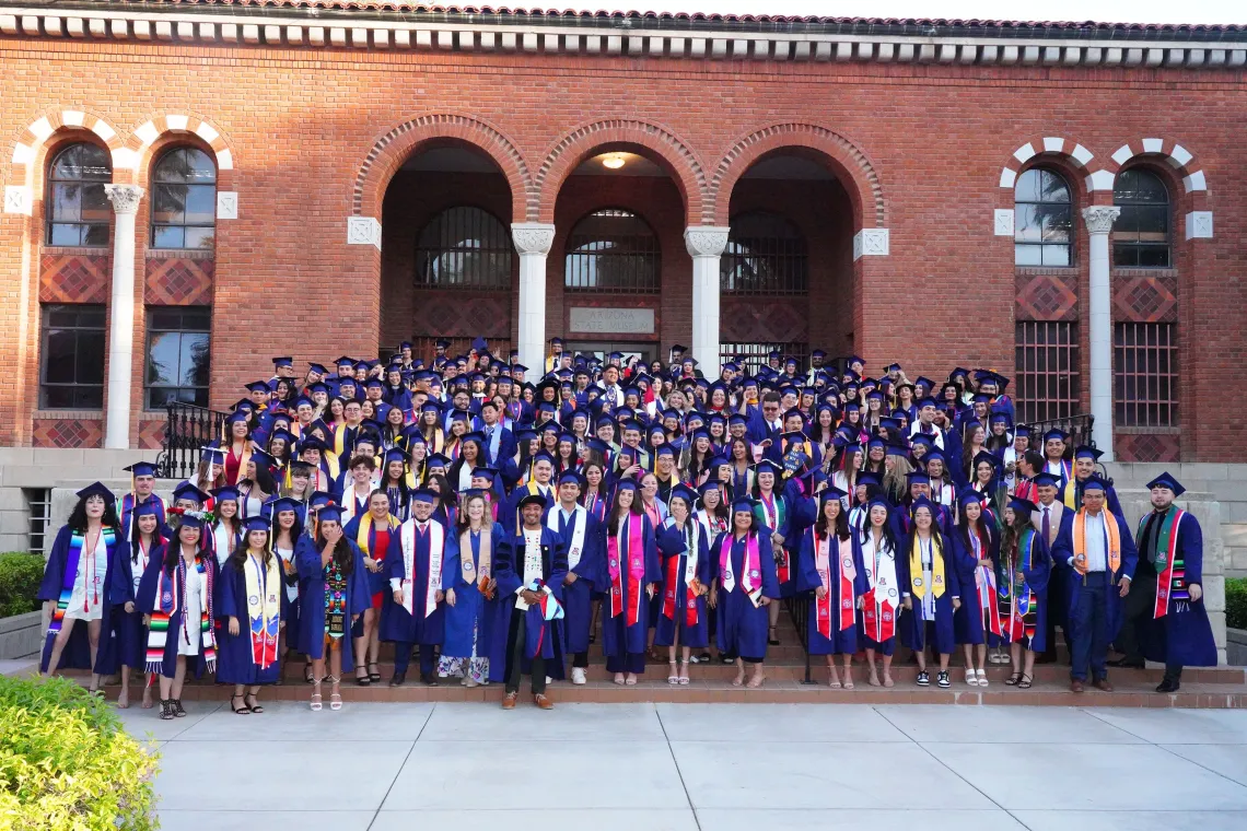 Group photo of students in their graduation regalia